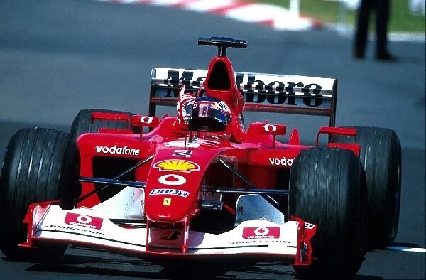 Formula One World Championship: Race winner Rubens Barrichello Ferrari F2002 waves to the crowd in celebration
