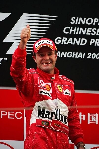 Formula One World Championship: Race winner Rubens Barrichello celebrates on the podium