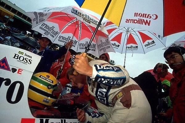 Formula One World Championship: Race winner Thierry Boutsen asks Ayrton Senna McLaren MP4  /  5 whether he believes the race should start