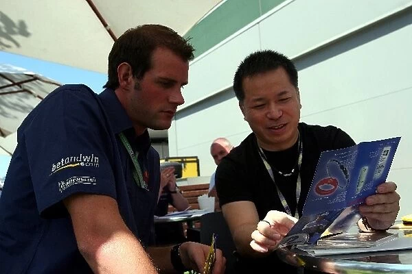 Formula One World Championship: A Red Bull mechanic with Massa Okikura Convex International