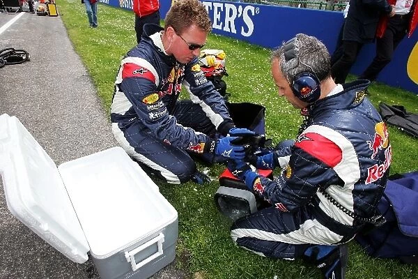 Formula One World Championship: Red Bull Racing mechanics with dry ice