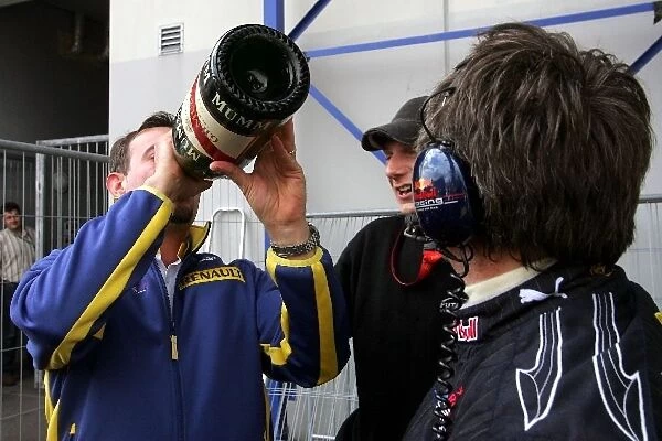 Formula One World Championship: Red Bull team members celebrate with Mark Webber Red Bull Racing champagne
