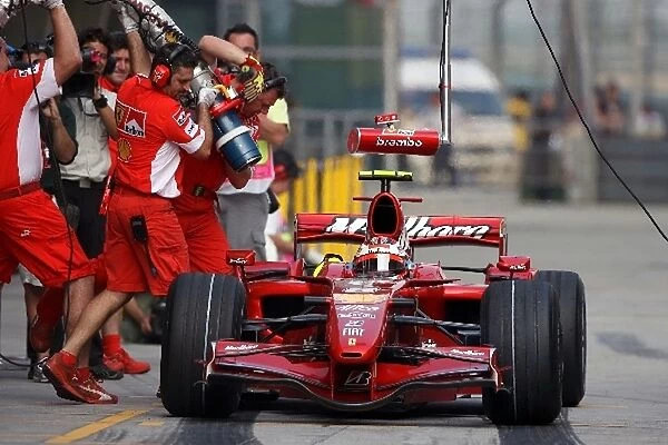 Formula One World Championship: Refuelling practice for Kimi Raikkonen Ferrari F2007