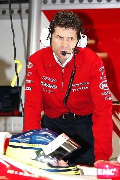 Formula One World Championship: Remi Decorzent Toyota Race Engineer looks over Cristiano Da Matta Toyota TF104
