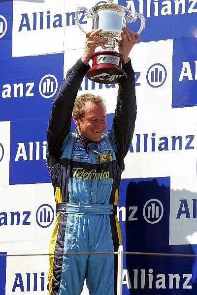 Formula One World Championship: Renault Chief Mechanic Jonathan Wheatley on the podium with the Constructors Trophy