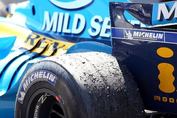 Formula One World Championship: The Renault of Fernando Alonso in Parc Ferme, showing the rear tyre wear