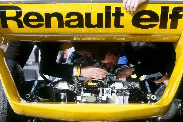 Formula One World Championship: Renault mechanics work on the rear of the Renault RS11 of Jean-Pierre Jabouille, who took the first ever GP vicrtory