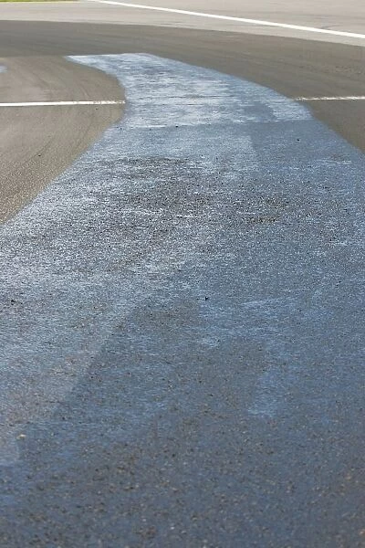 Formula One World Championship: A resin-like substance is laid onto the track at turn one to help the broken surface remain intact ready for the race