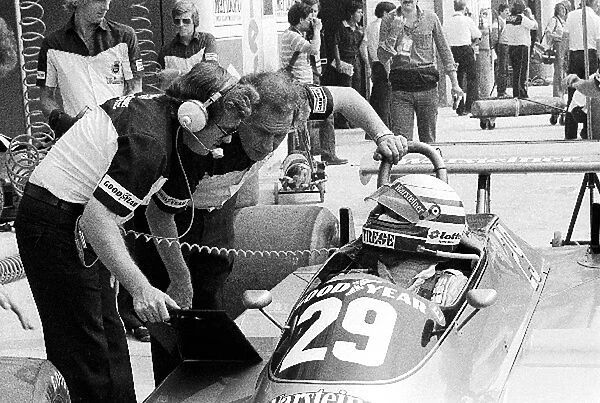 Formula One World Championship: Riccardo Patrese Arrows A3, who retired from the race on lap 39 with a blown engine, talks to his engineers during