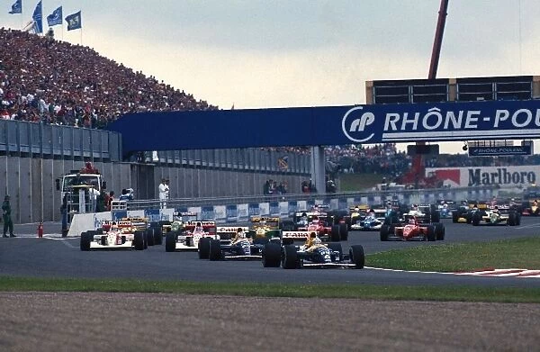 Formula One World Championship: Riccardo Patrese Williams FW14  /  B leads at the start of the race