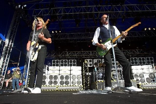 Formula One World Championship: Rick Parfitt, left, and Francis Rossi, right, of Status Quo rocks Silverstone at the post race concert