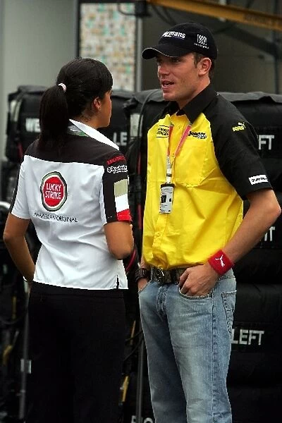 Formula One World Championship: Robert Doornbos Jordan Test Driver chats with a friend in the paddock
