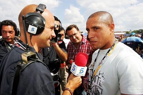 Formula One World Championship: Roberto Carlos Football Player is interviewed on the grid