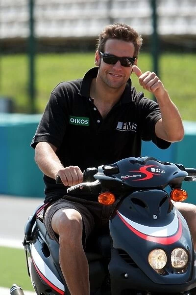 Formula One World Championship: Roldan Rodriguez FMS International on a scooter