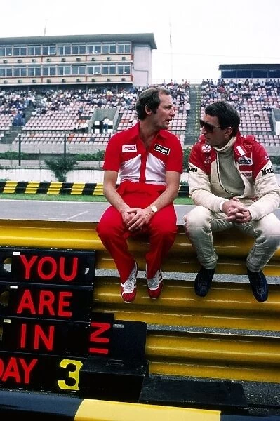 Formula One World Championship: Ron Dennis McLaren Team Owner talks with John Watson McLaren, who retired from the race on lap 37 with a crown wheel