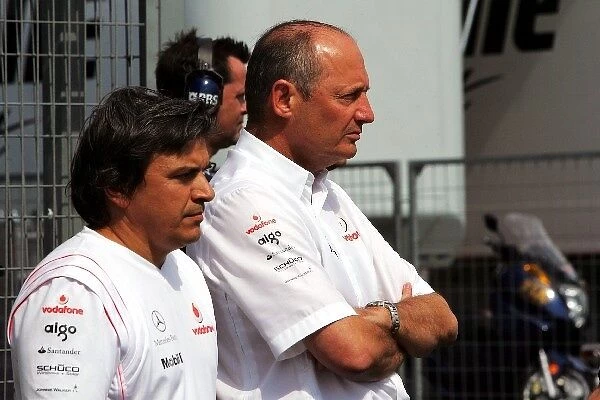 Formula One World Championship: Ron Dennis McLaren Team Principal with Fabrizio Borra, the trainer of Fernando Alonso McLaren, in parc ferme
