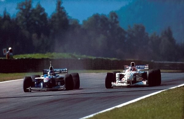 Formula One World Championship: Rubens Barrichello Stewart Ford SF1 leads Jacques Villeneuve Williams