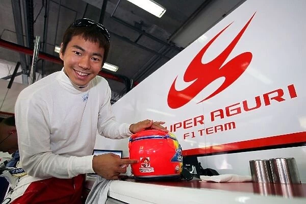Formula One World Championship: Sakon Yamamoto Super Aguri F1 Team Third Driver with a Japanese cartoon character on his helmet