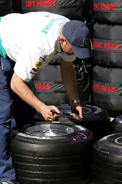 Formula One World Championship: Sauber mechanics prepare tyres
