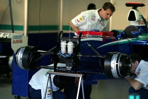 Formula One World Championship: Sauber mechanics work in the garage