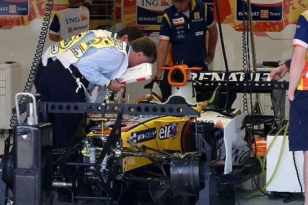 Formula One World Championship: Scrutineers in the Renault garage