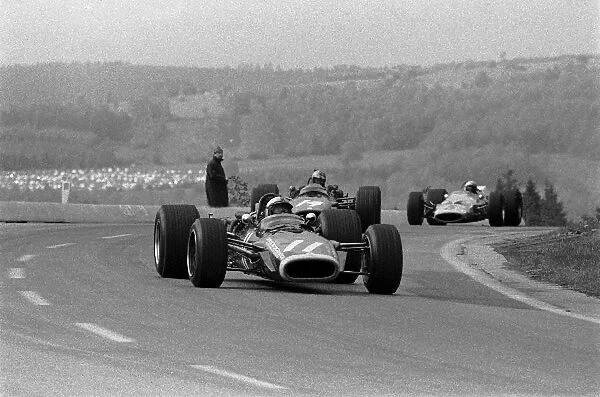 Formula One World Championship: Second place finisher Pedro Rodriguez BRM P133 leads Piers Courage BRM P126 who retired with engine trouble
