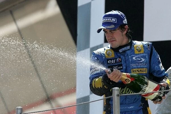 Formula One World Championship: Second place finisher Fernando Alonso sprays the champagne