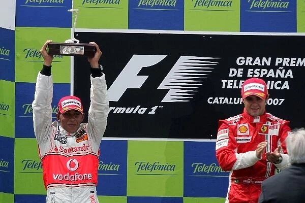 Formula One World Championship: Second place Lewis Hamilton Mclaren and race winner Felipe Massa Ferrari on the podium