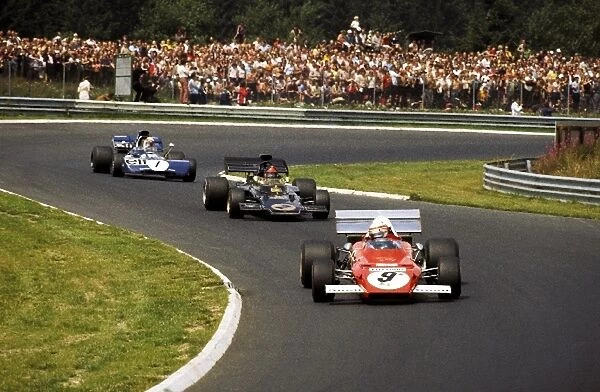 Formula One World Championship: Second placed Clay Regazzoni Ferrari 312B2 leads Emerson Fittipaldi Lotus 72D and Jackie Stewart Tyrrell 003