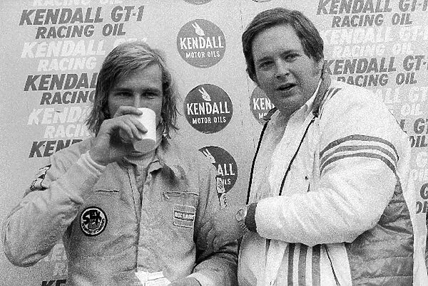 Formula One World Championship: Second placed James Hunt Hesketh enjoys a cup of milk with Lord Alexander Hesketh Hesketh Team Owner on the podium