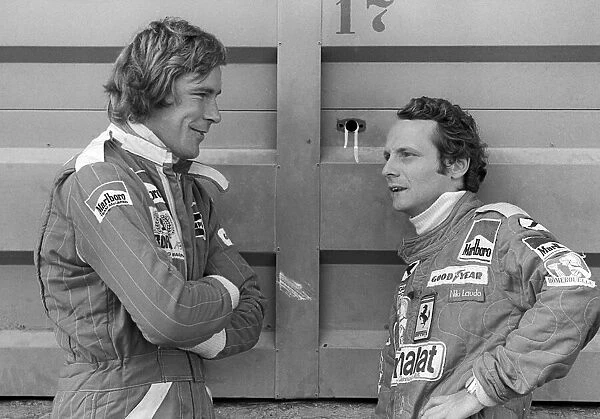 Formula One World Championship: Second placed James Hunt McLaren, talks with race winner Niki Lauda Ferrari