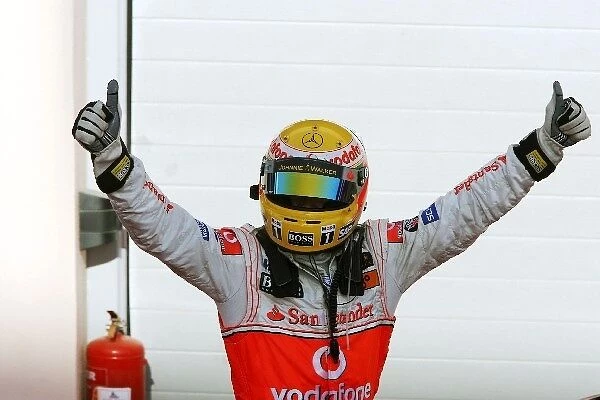 Formula One World Championship: Second placed Lewis Hamilton McLaren celebrates in parc ferme