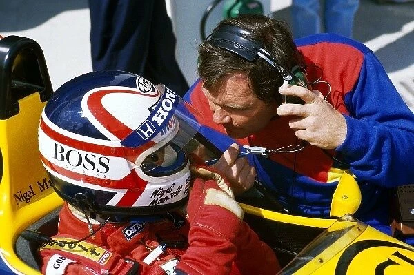 Formula One World Championship: Second placed Nigel Mansell Williams FW11 talks with Patrick Head Williams Technical Director