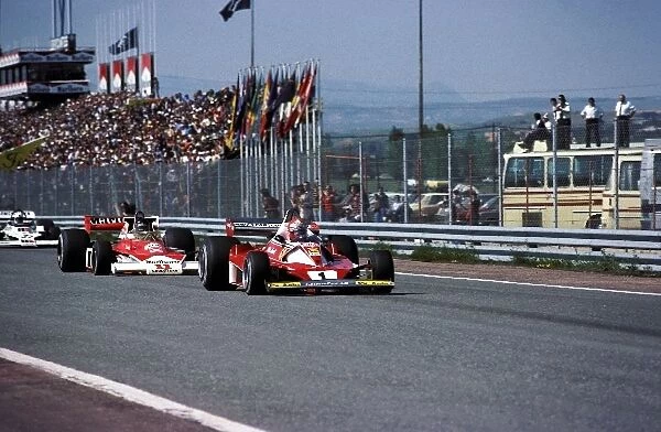 Formula One World Championship: Second placed Niki Lauda Ferrari 312T2 leads James Hunt McLaren M23, who won, was then disqualified for a technical