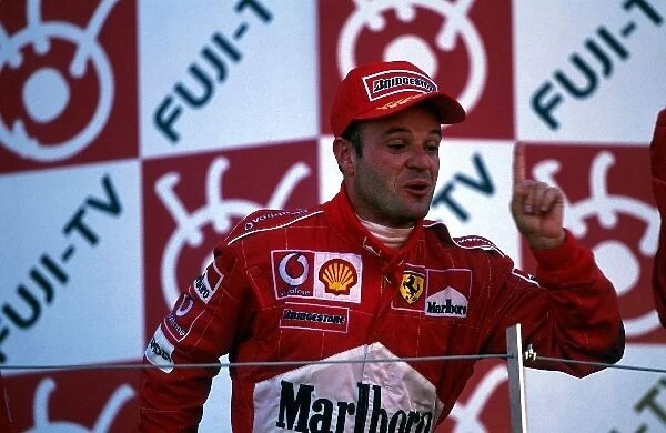 Formula One World Championship: Second placed Rubens Barrichello Ferrari celebrates on the podium