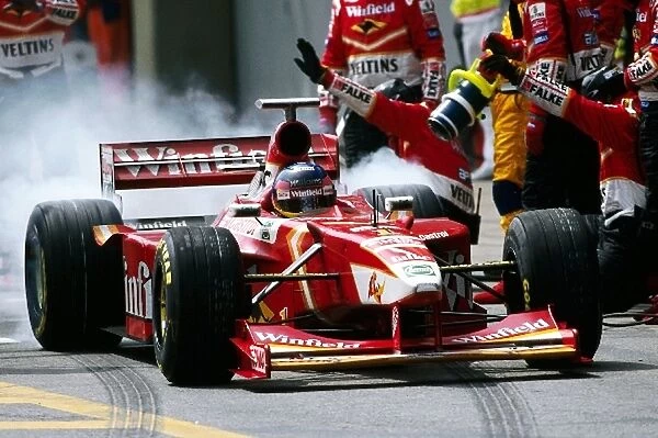 Formula One World Championship: Seventh placed Jacques Villeneuve Williams FW20 makes a pit stop