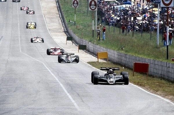 Formula One World Championship: Seventh placed Mario Andretti Lotus 78 leads the opening laps of the race