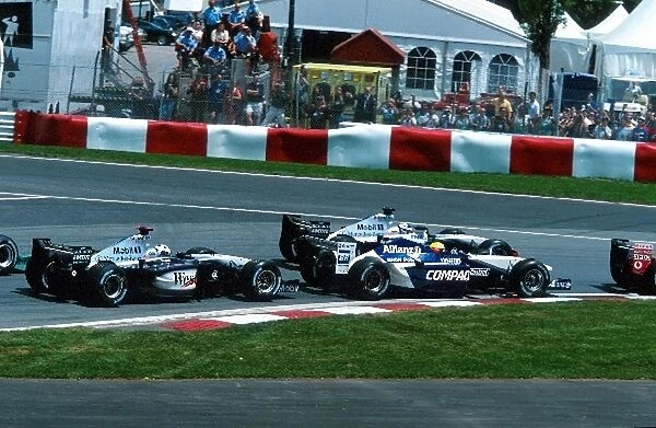 Formula One World Championship: Seventh placed Ralf Schumacher Williams FW24 is passed around the outside by fourth placed Kimi Raikkonen McLaren