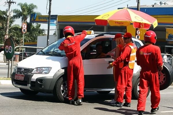 Formula One World Championship: Shell pit stop crew outside the circuit