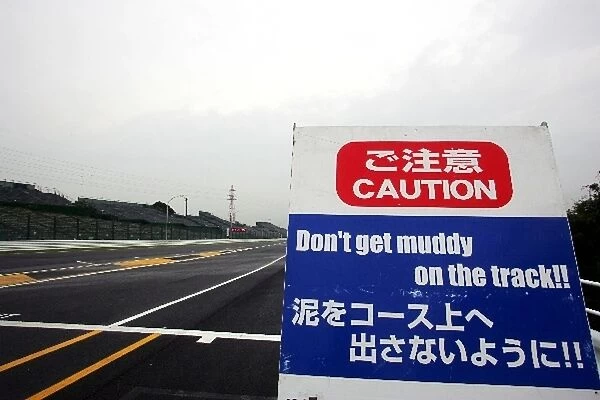 Formula One World Championship: Sign warning against getting muddy on the track