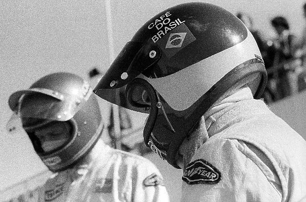 Formula One World Championship: Sixth placed Emerson Fittipaldi prepares to head onto the circuit with his race winning Lotus team mate Ronnie