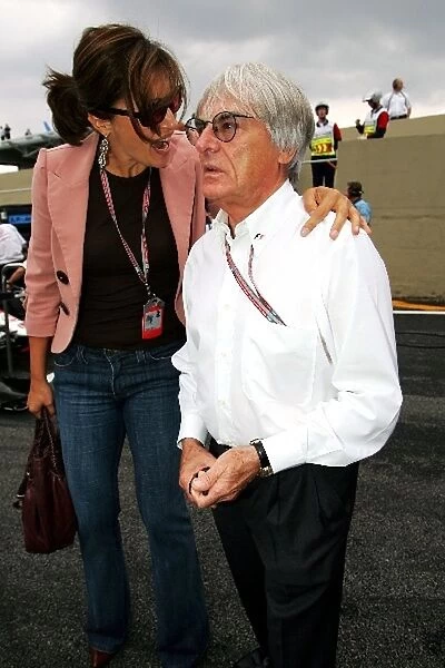 Formula One World Championship: Slavica Ecclestone with Bernie Ecclestone F1 Supremo on the grid