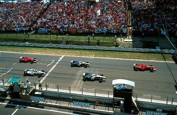 Formula One World Championship: Start, Schumacher gets away first with Coulthard and Hakkinen close behind