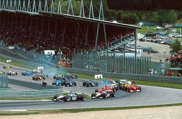 Formula One World Championship: Start incident with Schumacher and Zonta as two Mclarens of Hakkinen and Coulthard lead