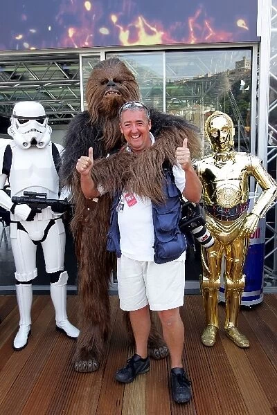 Formula One World Championship: Storm Troopers, Darth Vader, Chewbacca and C3-P0 corner Mark Sutton in the pits