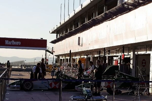 Formula One World Championship: The sun sets over Budapest and the Jaguar team in the pits