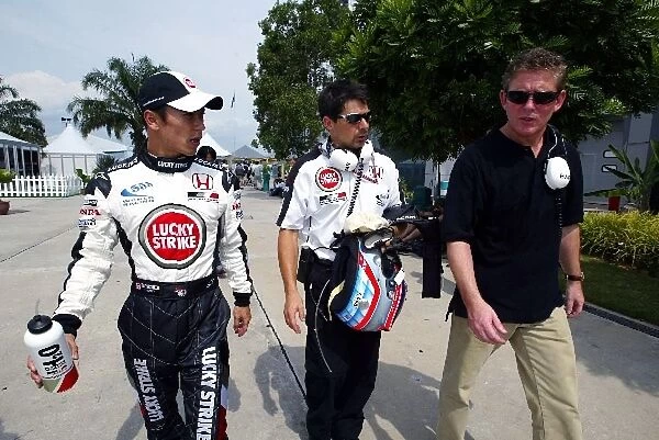 Formula One World Championship: Takuma Sato BAR talks with his manager Andrew Gilbert-Scott