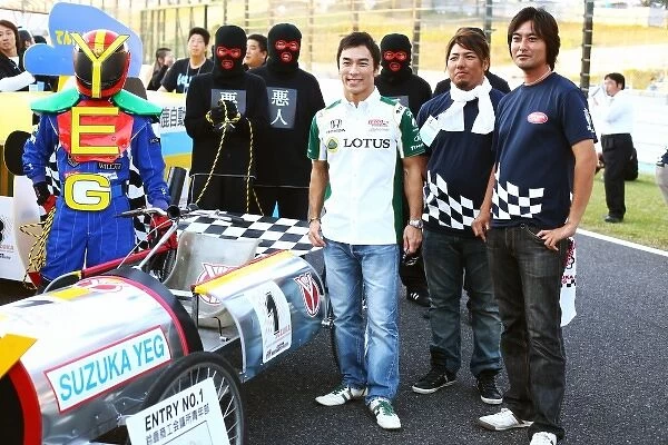 Formula One World Championship: Takuma Sato with Box Kart competitors