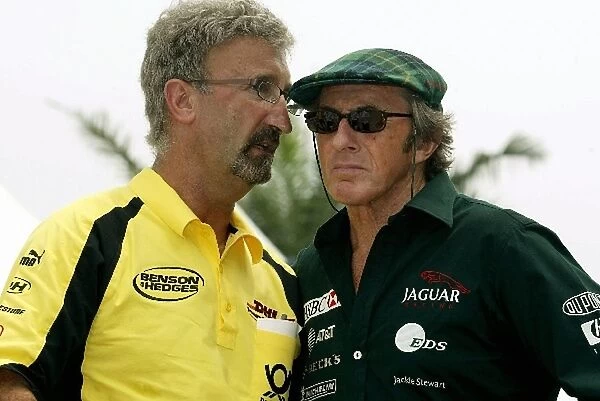 Formula One World Championship: Team Owner Eddie Jordan has a word in the ear of Sir Jackie Stewart Jaguar associate