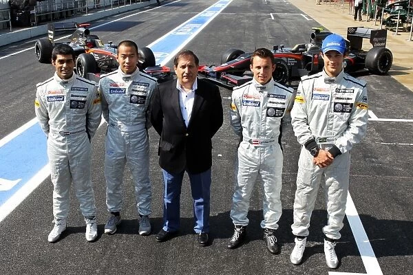 Formula One World Championship: A team photo for the Hispania Racing F1 Team: Karun Chandhok; Sakon Yamamoto Test and Reserve Driver; Jose Ramon